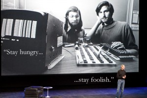 Steve Jobs and Steve Wozniak working on the first Apple computer